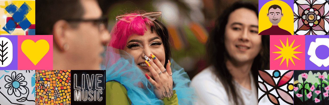 Three students chatting. One has pink hair and colourful nails