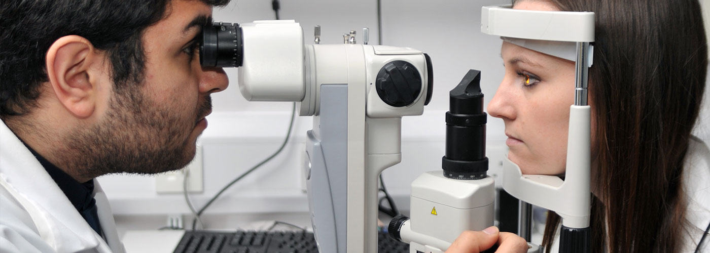 Two optometry students conducting an eye test.